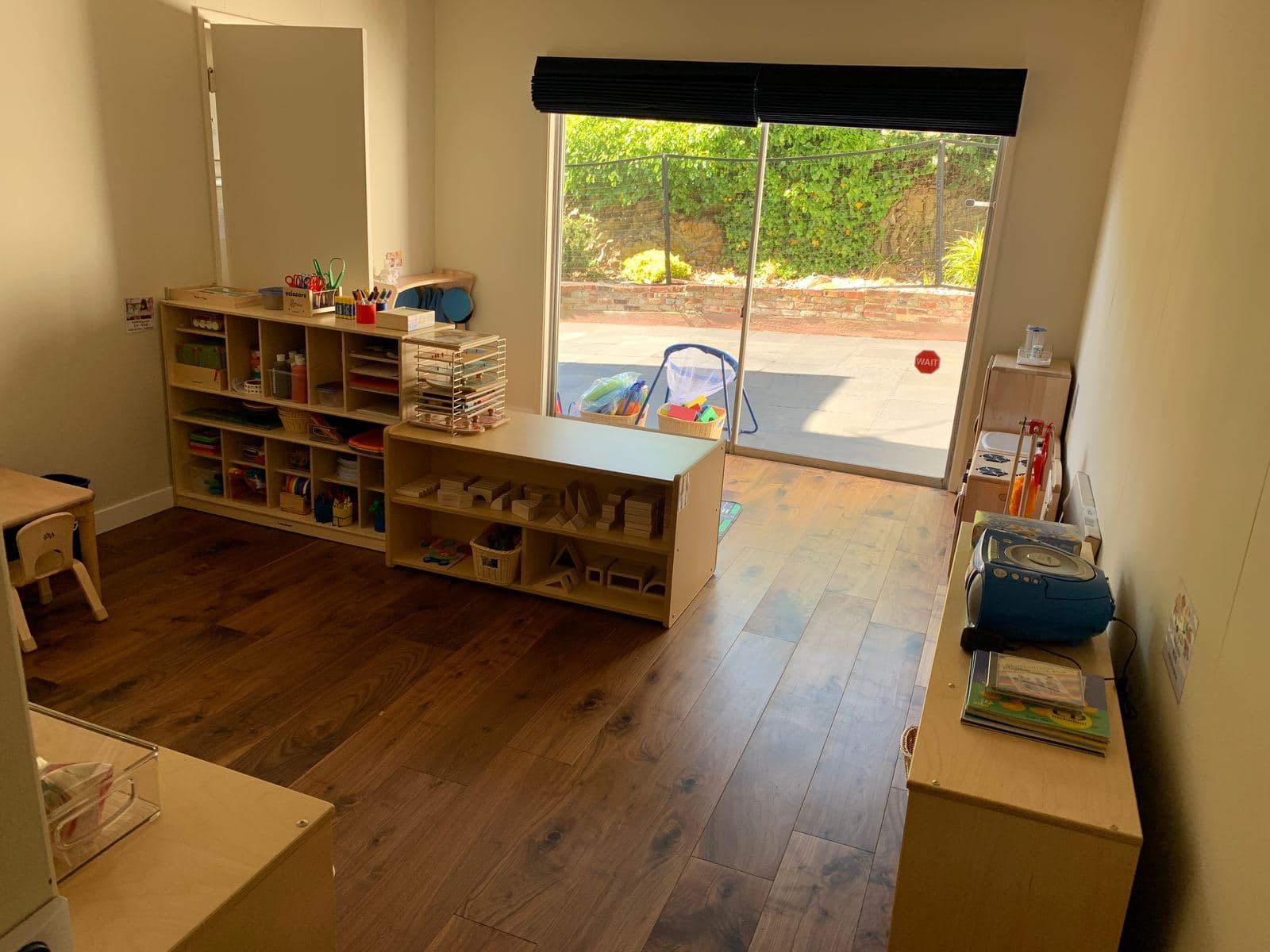 Indoor classroom with open learning shelves and natural light at Wisely SF